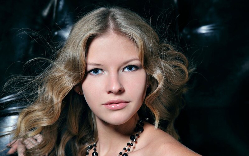 woman with blonde hair and blue eyes