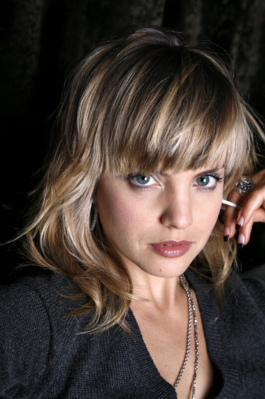 woman with blonde hair and blue eyes