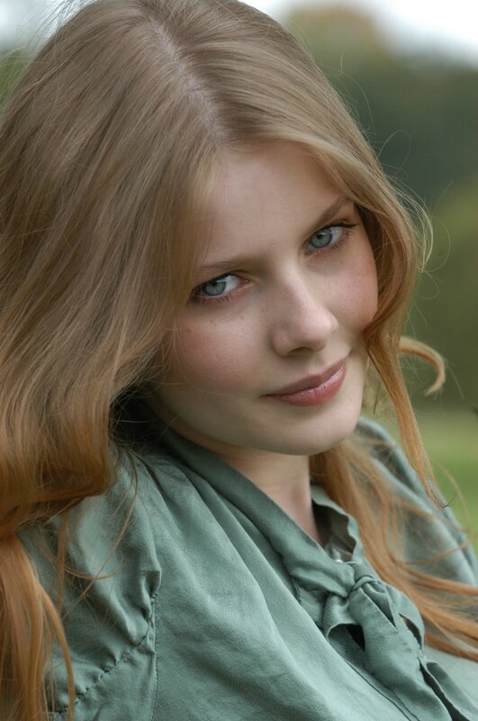 woman with blonde hair and blue eyes