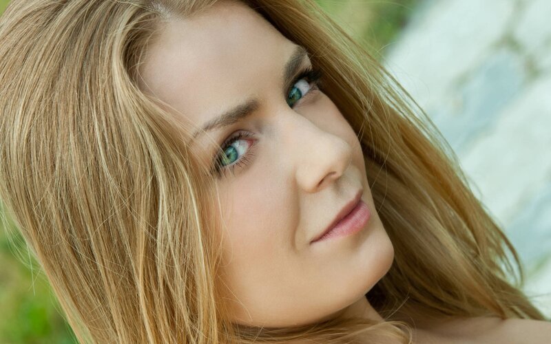 woman with blonde hair and blue eyes