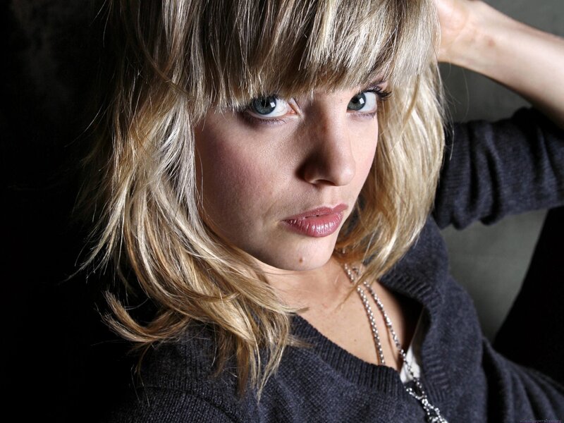 woman with blonde hair and blue eyes