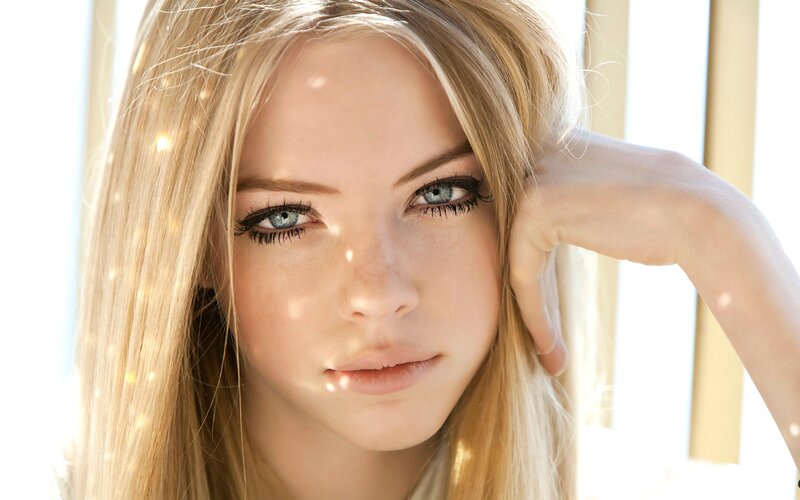 woman with blonde hair and blue eyes
