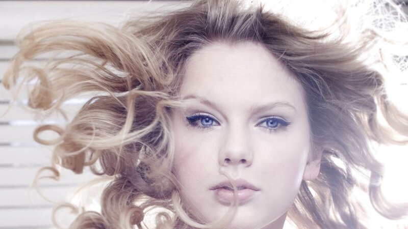 woman with blonde hair and blue eyes