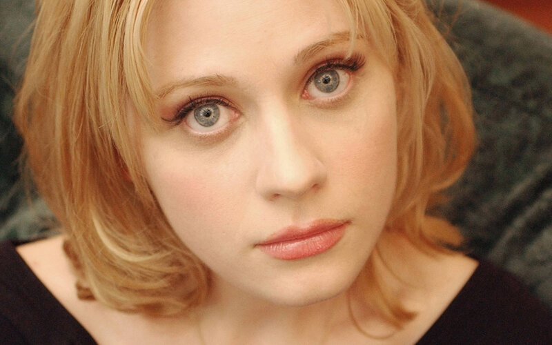 woman with blonde hair and blue eyes