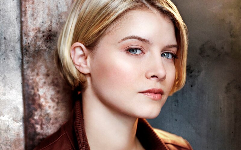 woman with blonde hair and blue eyes