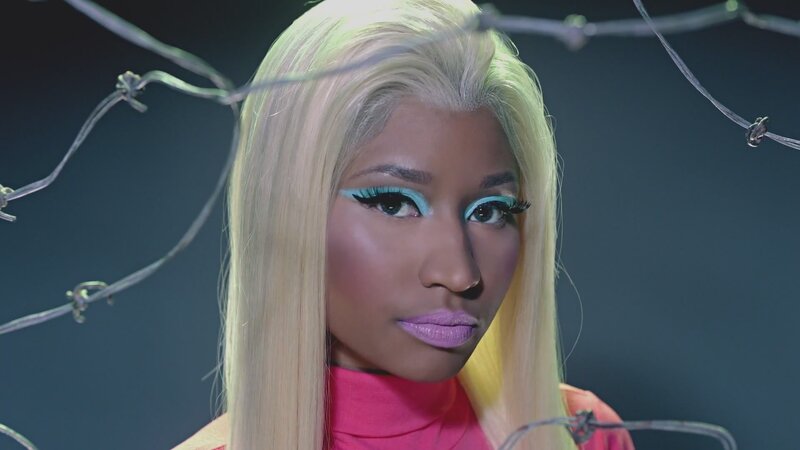 woman with blonde hair and colorful makeup