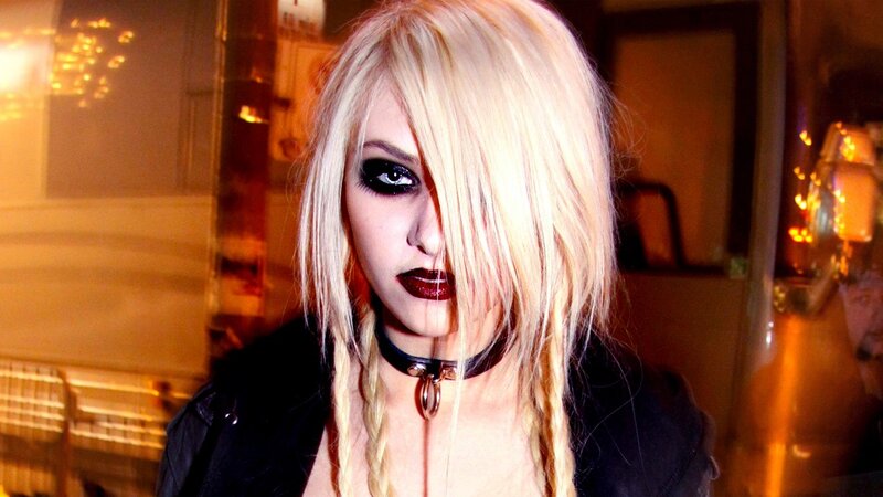 woman with blonde hair and dark makeup
