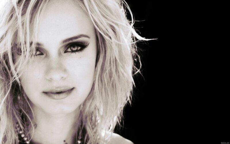 woman with blonde hair and dark makeup