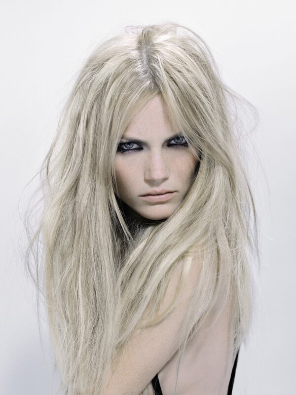 woman with blonde hair and dark makeup