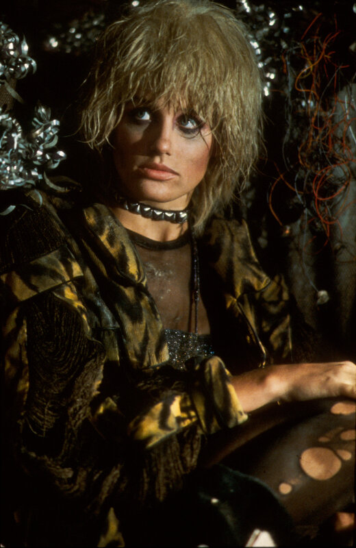 Woman with blonde hair and dark makeup