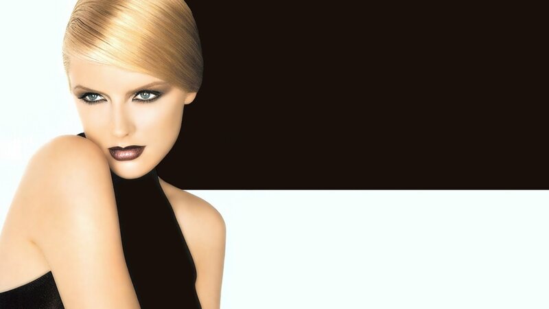 woman with blonde hair and dark makeup