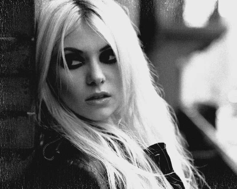woman with blonde hair and dark makeup