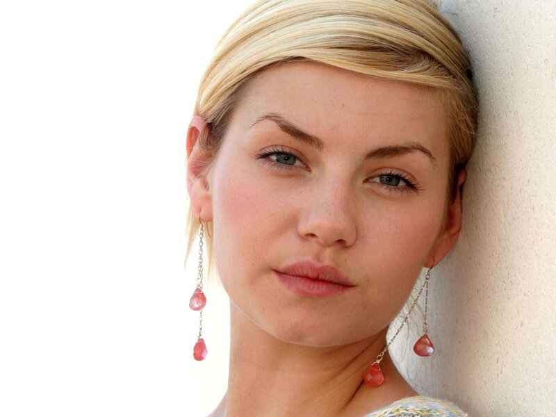 woman with blonde hair and earrings