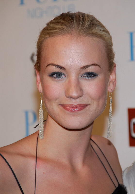 woman with blonde hair and earrings