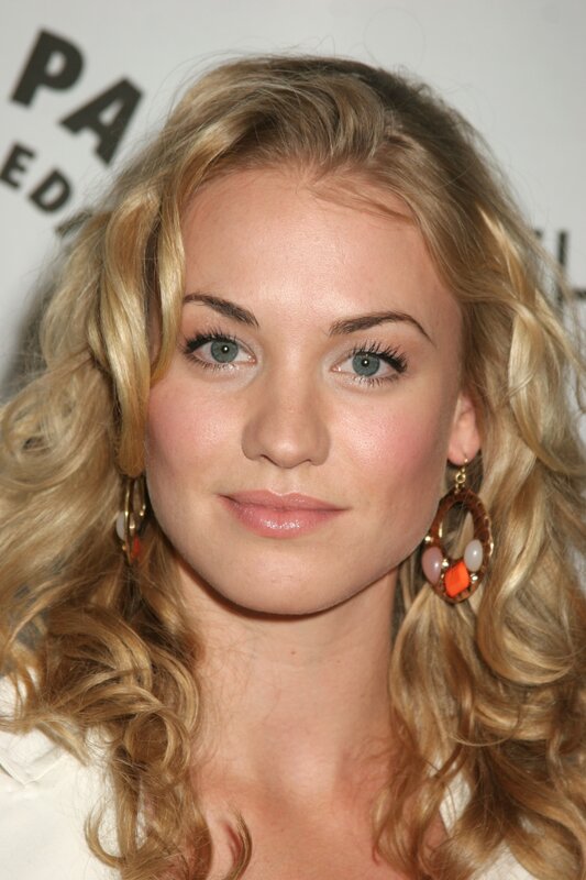 woman with blonde hair and earrings