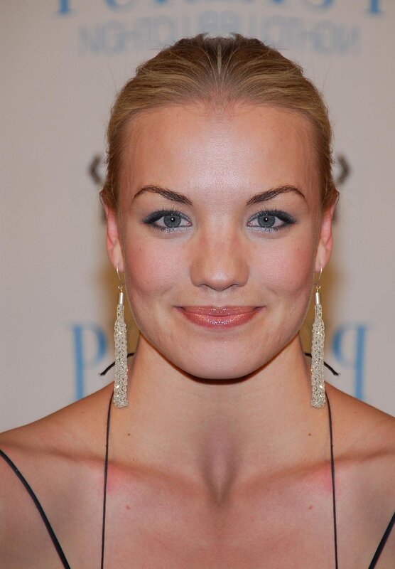woman with blonde hair and earrings