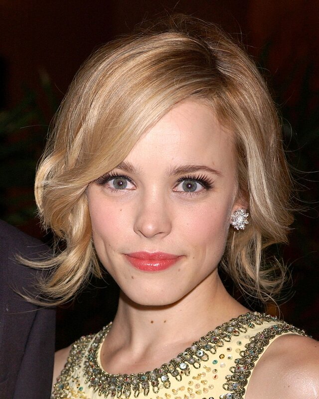 woman with blonde hair and earrings
