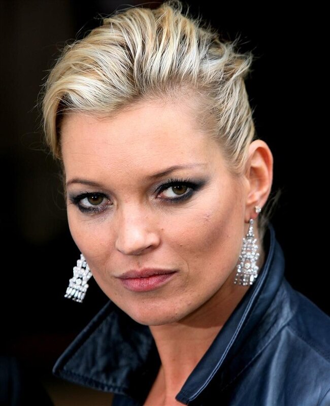 woman with blonde hair and earrings