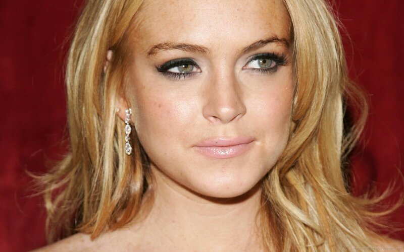 woman with blonde hair and earrings