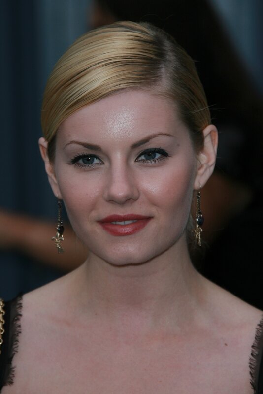 woman with blonde hair and earrings