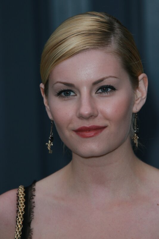 woman with blonde hair and earrings