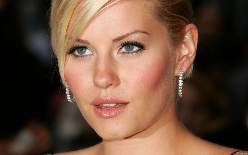 woman with blonde hair and earrings