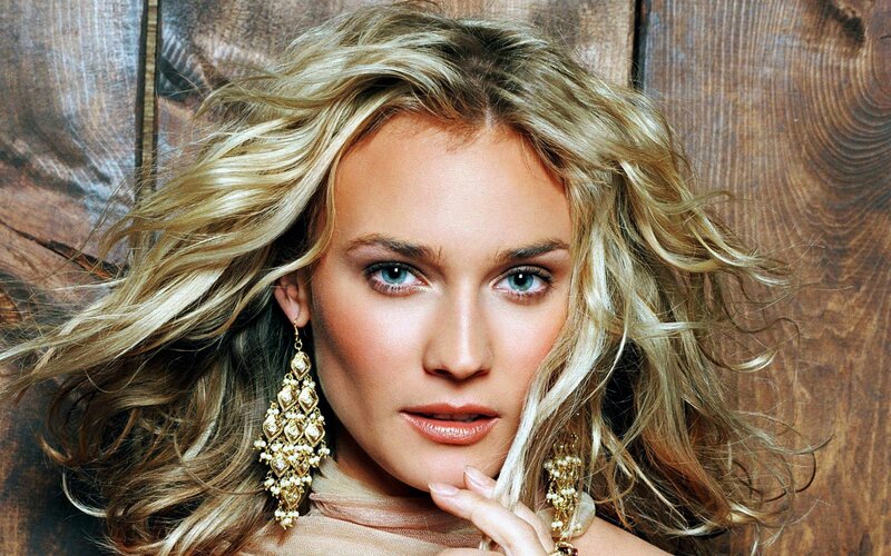woman with blonde hair and earrings