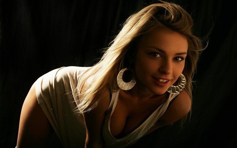 woman with blonde hair and earrings
