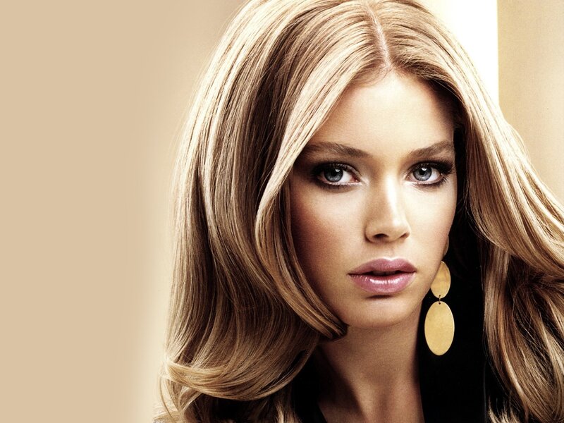 woman with blonde hair and earrings