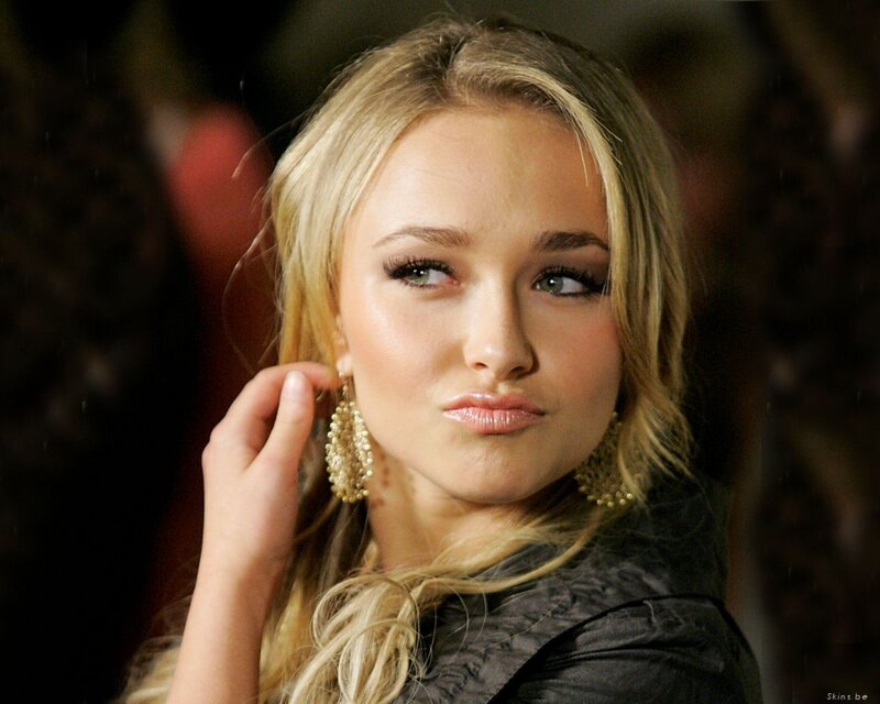 woman with blonde hair and earrings