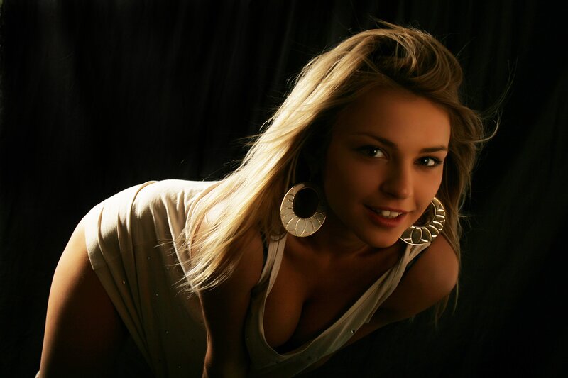 woman with blonde hair and earrings