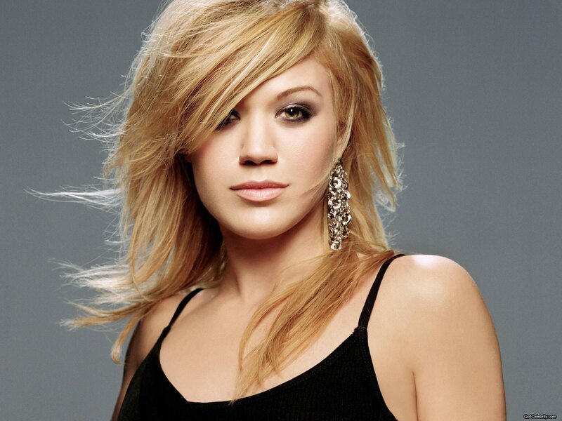 woman with blonde hair and earrings