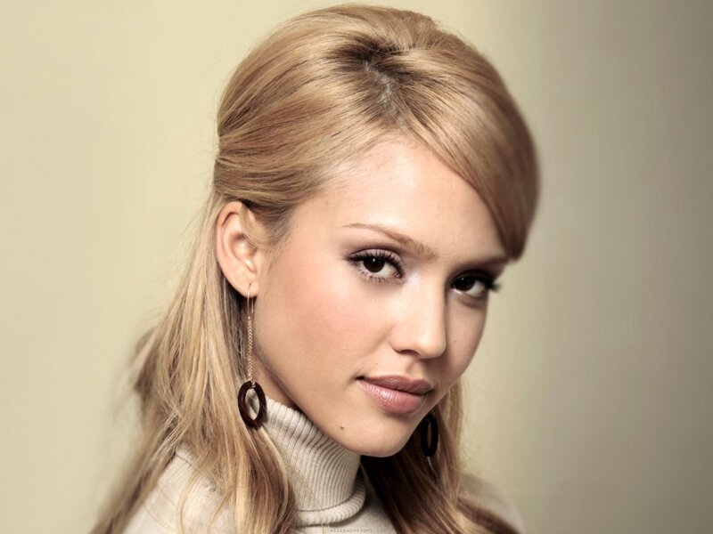 woman with blonde hair and earrings