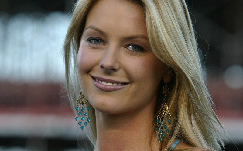 woman with blonde hair and earrings