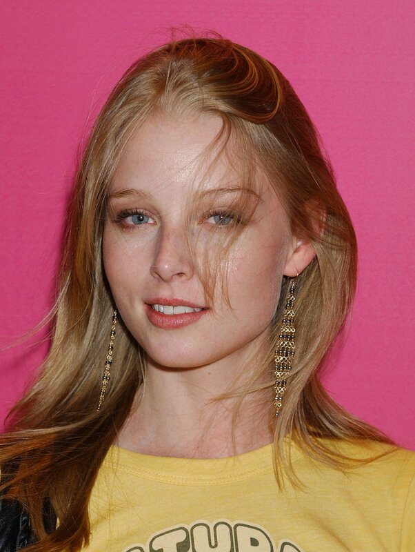 woman with blonde hair and earrings