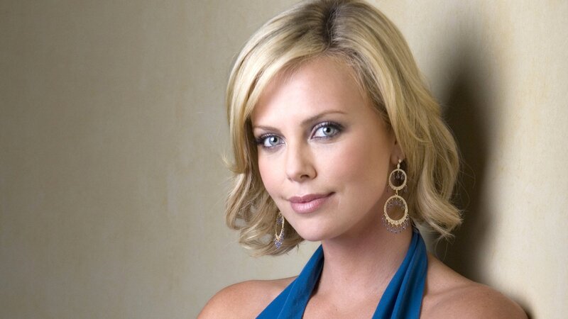 woman with blonde hair and earrings