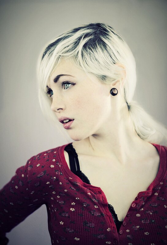 woman with blonde hair and earrings