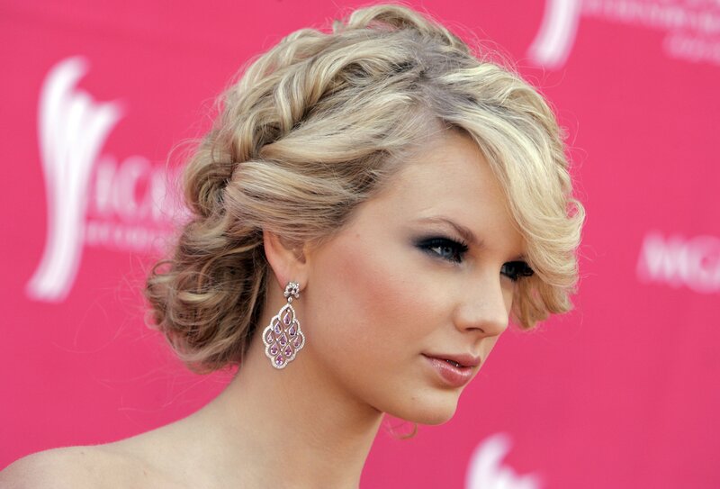 woman with blonde hair and earrings