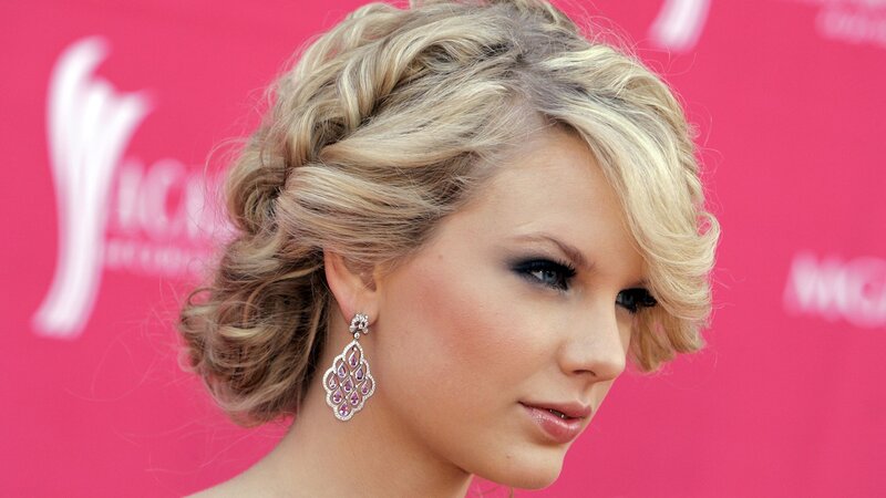 woman with blonde hair and earrings