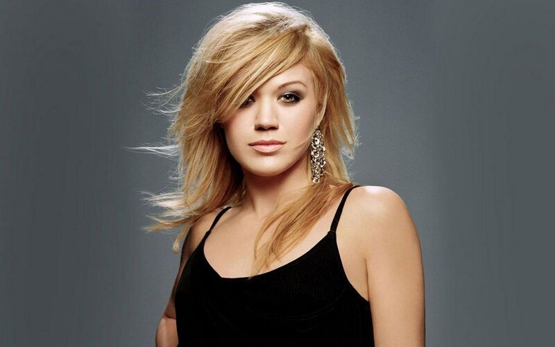 woman with blonde hair and earrings