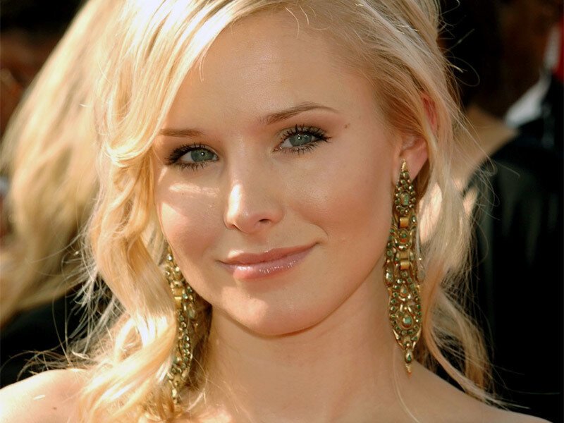 woman with blonde hair and earrings