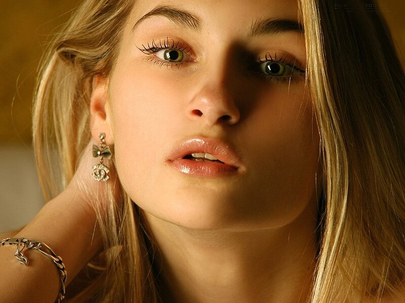 woman with blonde hair and earrings