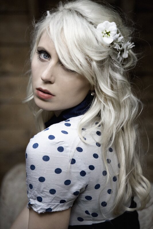 woman with blonde hair and flowers