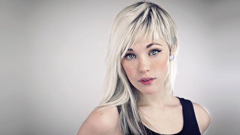 woman with blonde hair and freckles