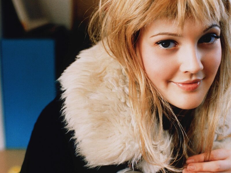 woman with blonde hair and fur collar