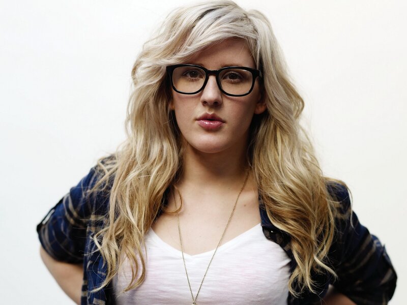woman with blonde hair and glasses