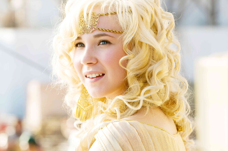 woman with blonde hair and golden headpiece