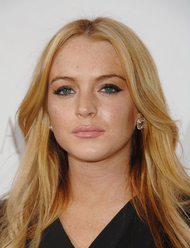 woman with blonde hair and green eyes