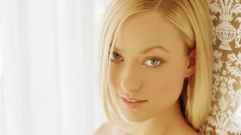 woman with blonde hair and green eyes