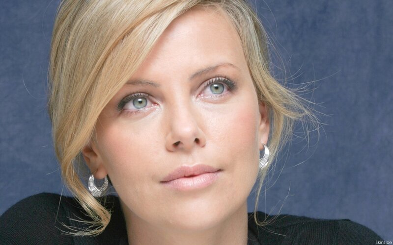 woman with blonde hair and green eyes